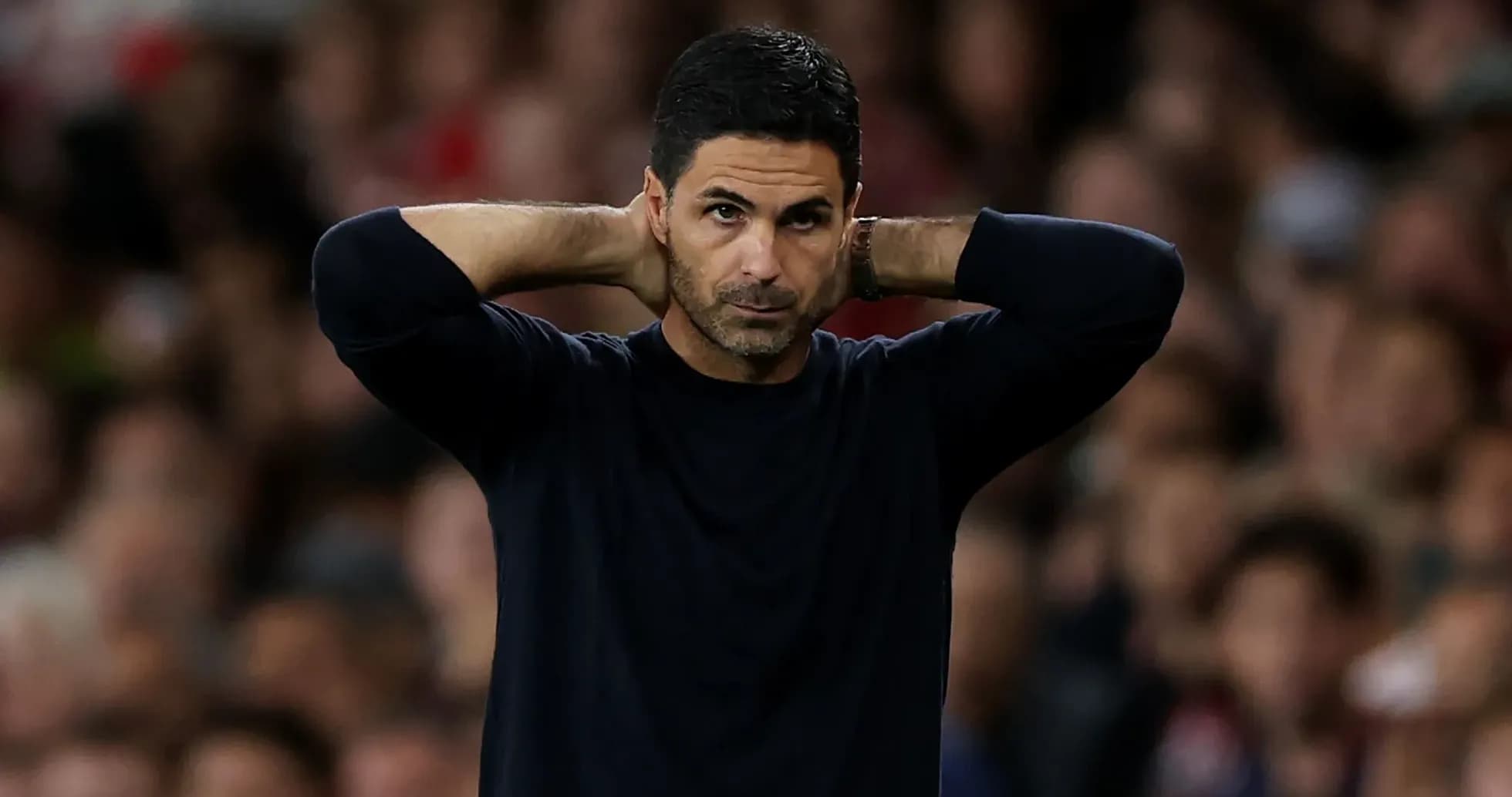 Manager with hands behind head during match Manager with hands behind head during match