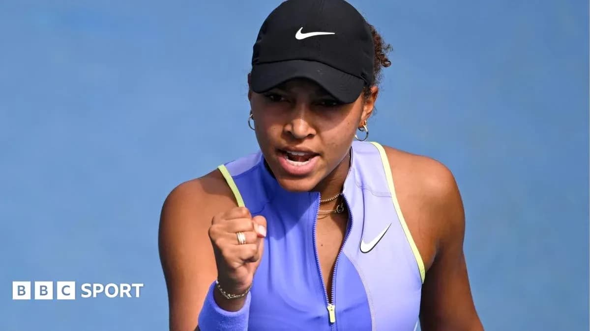 Tennis player celebrating with a clenched fist Tennis player celebrating with a clenched fist