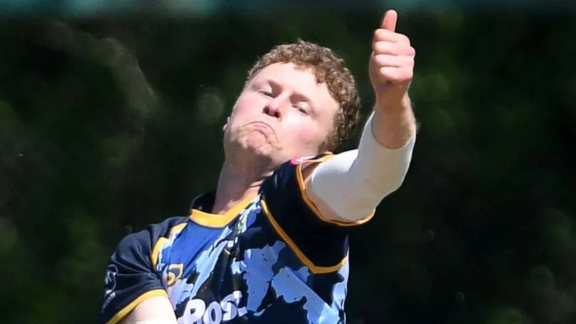 Cricketer bowling with a thumbs up gesture Cricketer bowling with a thumbs up gesture