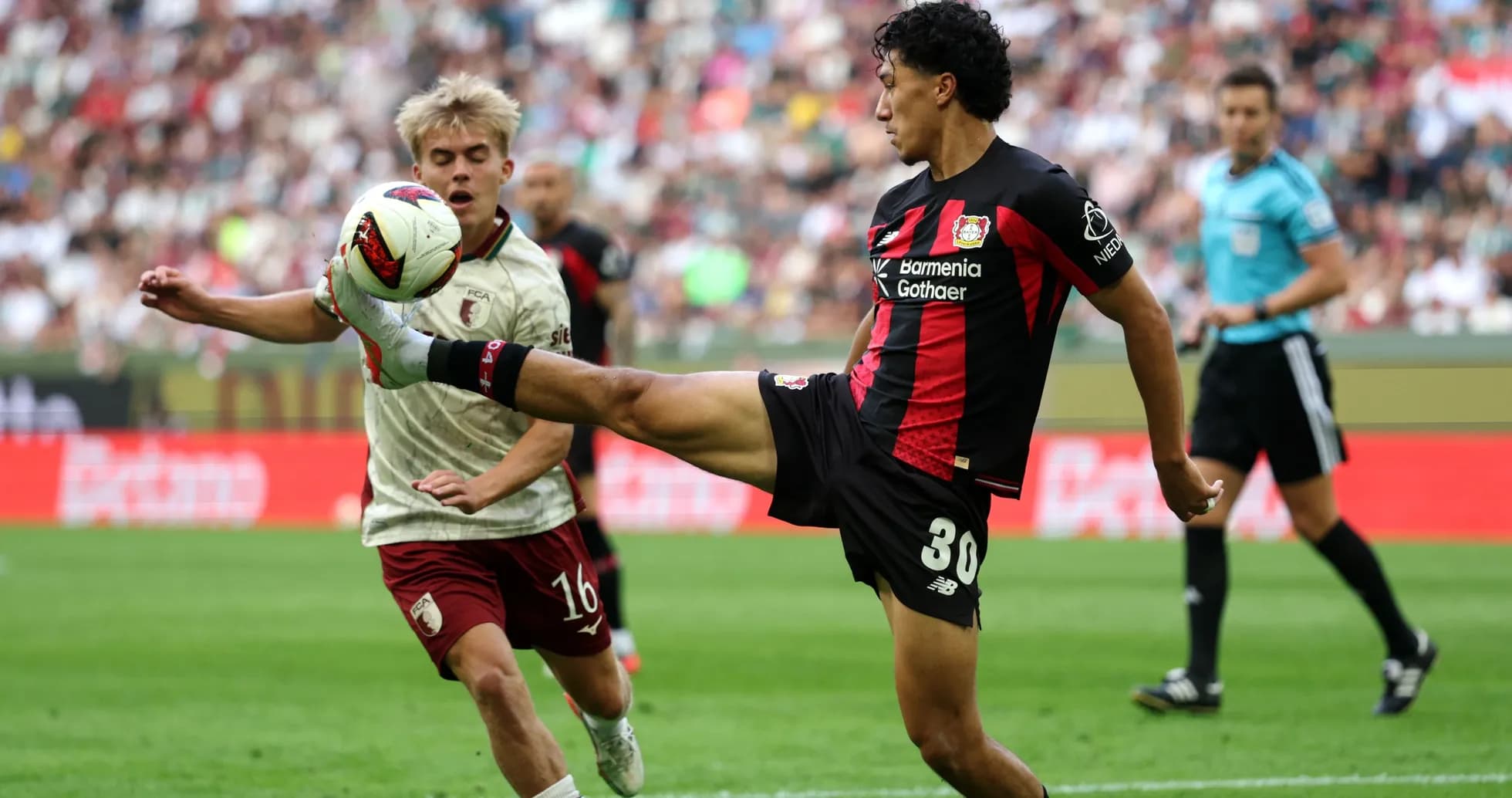Player kicking the ball during a football match Player kicking the ball during a football match