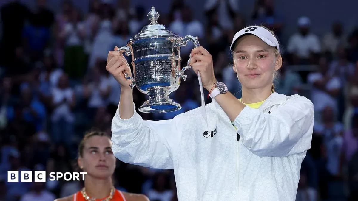Player holding trophy with opponent in background Player holding trophy with opponent in background