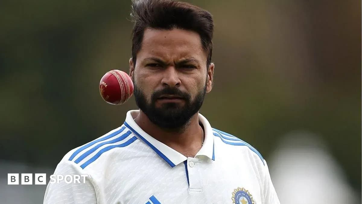 Cricketer preparing to bowl with cricket ball Cricketer preparing to bowl with cricket ball