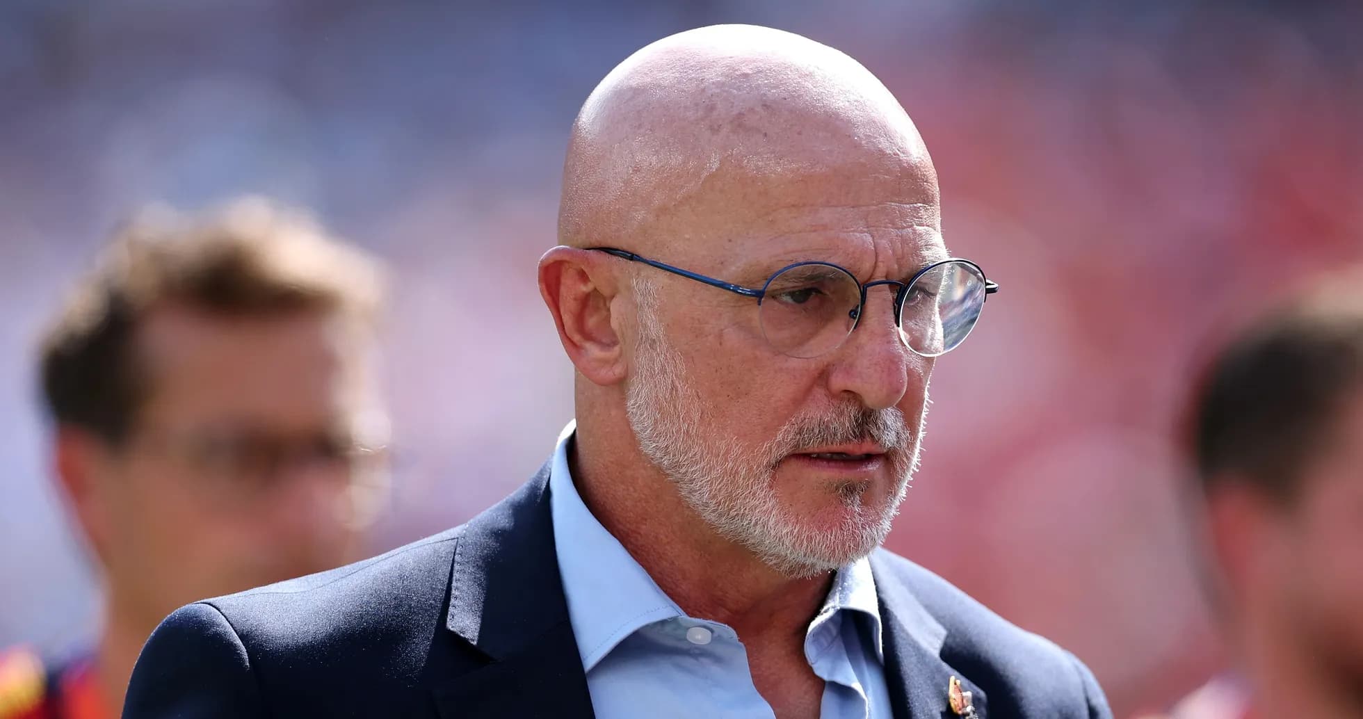 Man in glasses walking on the sidelines Man in glasses walking on the sidelines