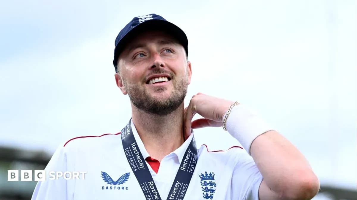 Cricketer wearing a medal, smiling at the camera Cricketer wearing a medal, smiling at the camera