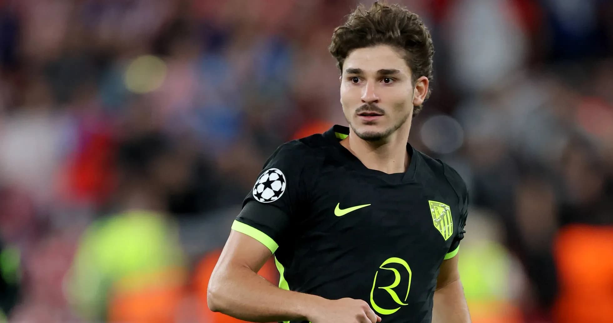Player in black kit during Champions League match Player in black kit during Champions League match