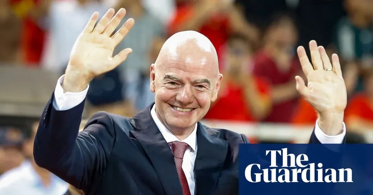 Man in suit waving to crowd at event Man in suit waving to crowd at event