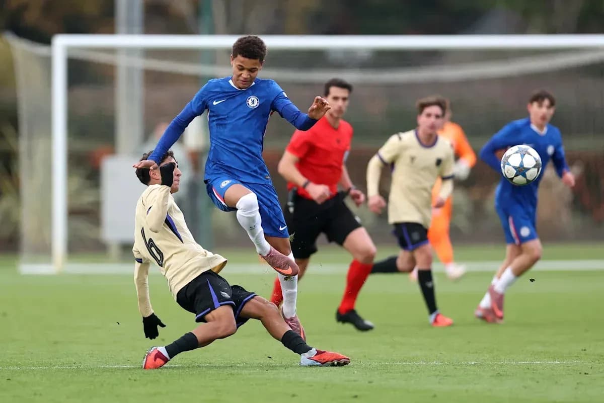 Player in blue jumping over opponent on ground Player in blue jumping over opponent on ground
