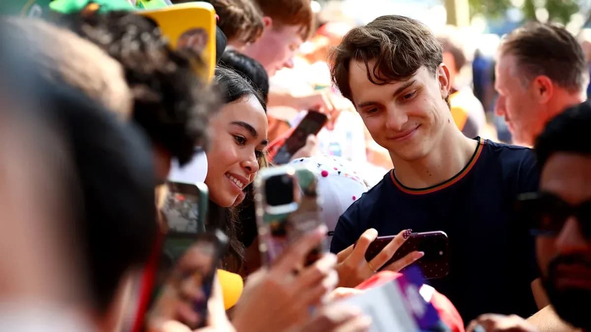 Fans taking selfies with a celebrity at event Fans taking selfies with a celebrity at event
