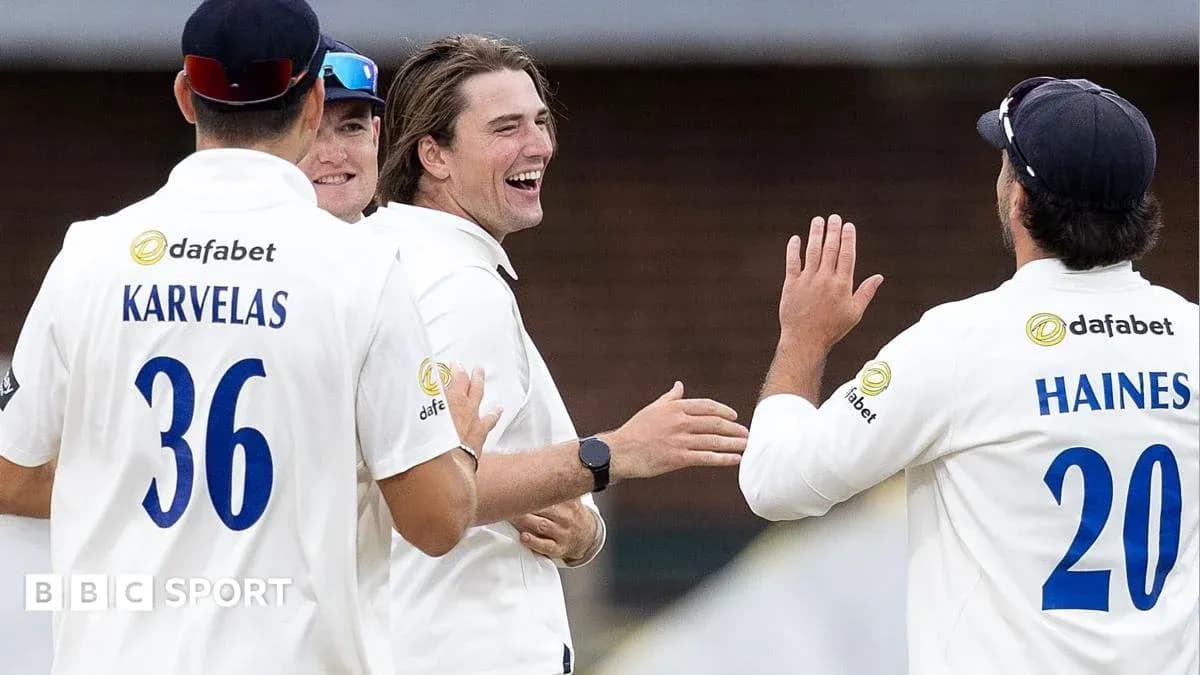 Cricket team celebrating a wicket on the field Cricket team celebrating a wicket on the field