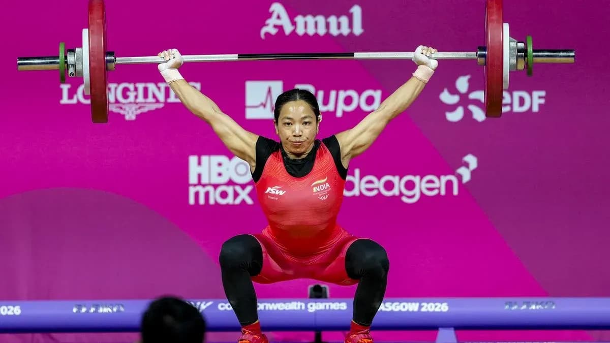 Weightlifter performing a lift at competition Weightlifter performing a lift at competition