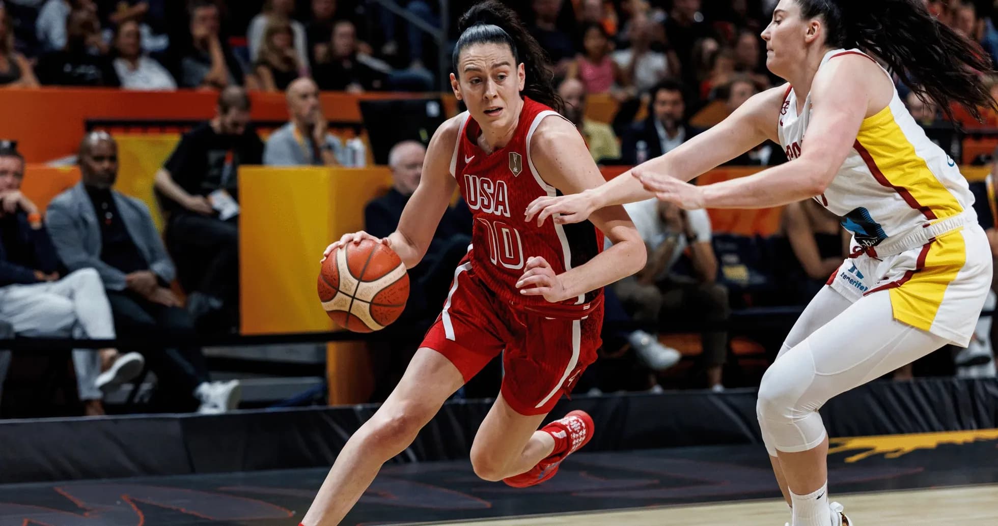 USA player dribbling past defender during basketball game USA player dribbling past defender during basketball game