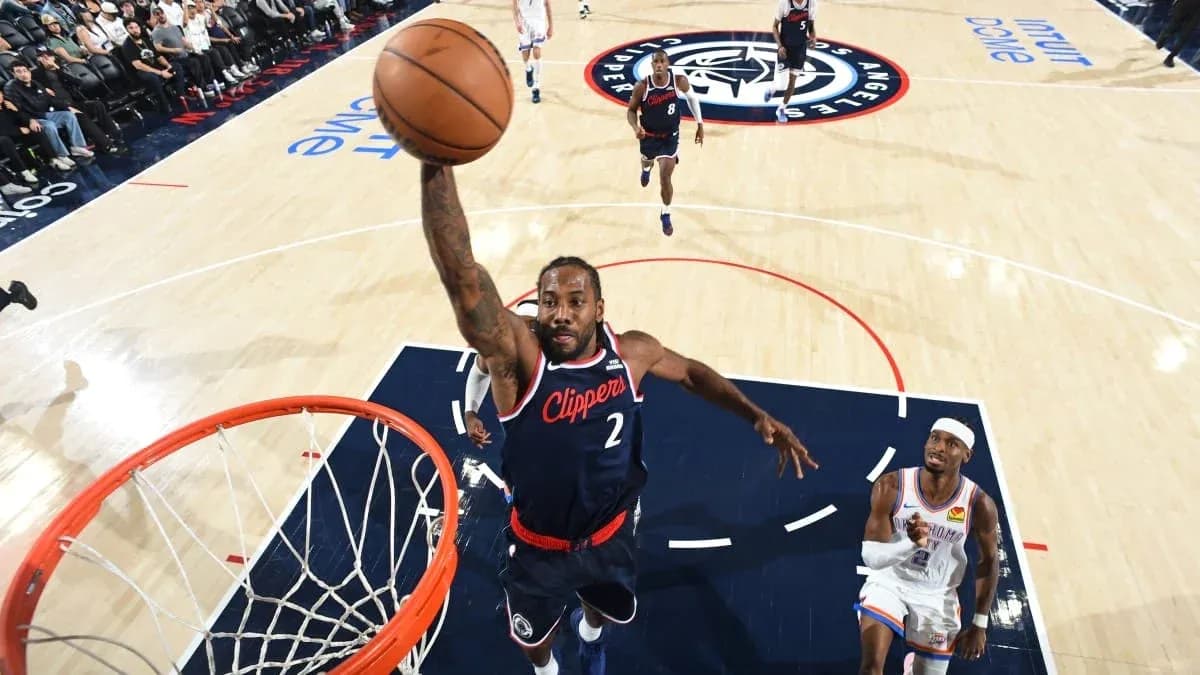 Player dunking during a basketball game action Player dunking during a basketball game action