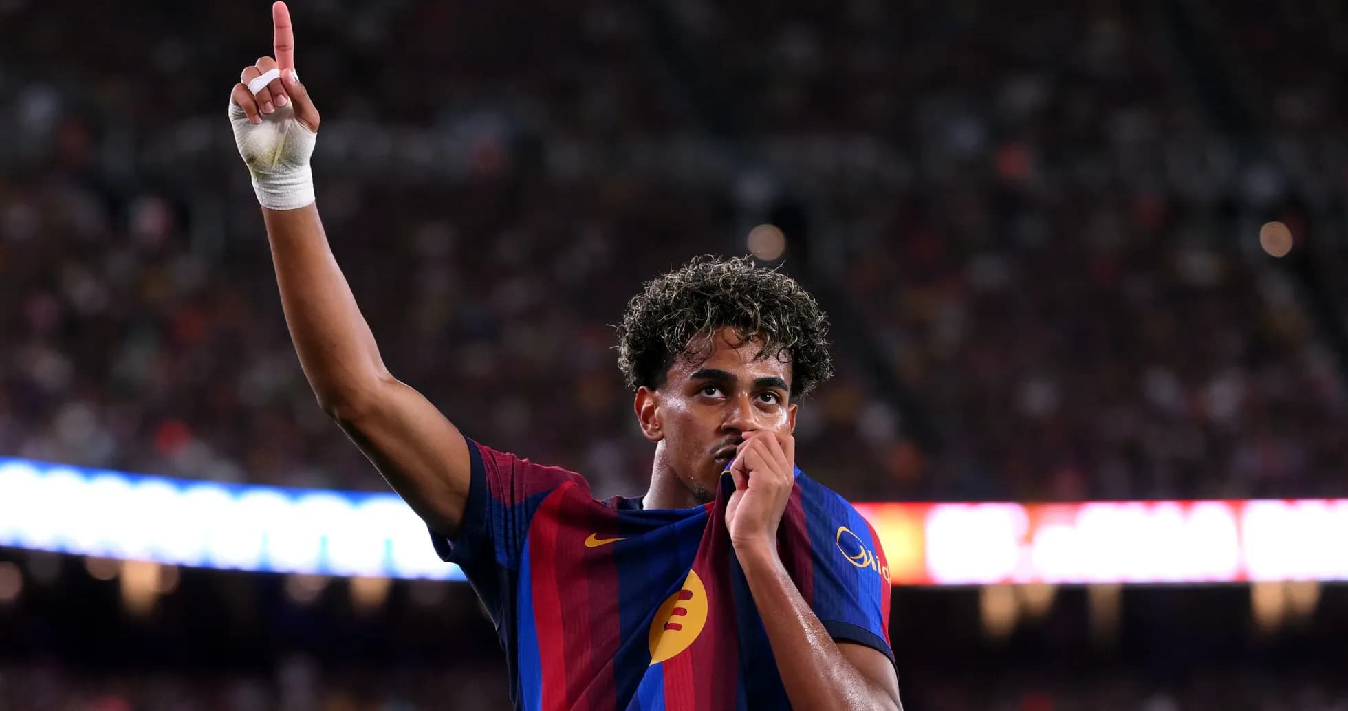 Player celebrating by raising finger and kissing jersey Player celebrating by raising finger and kissing jersey