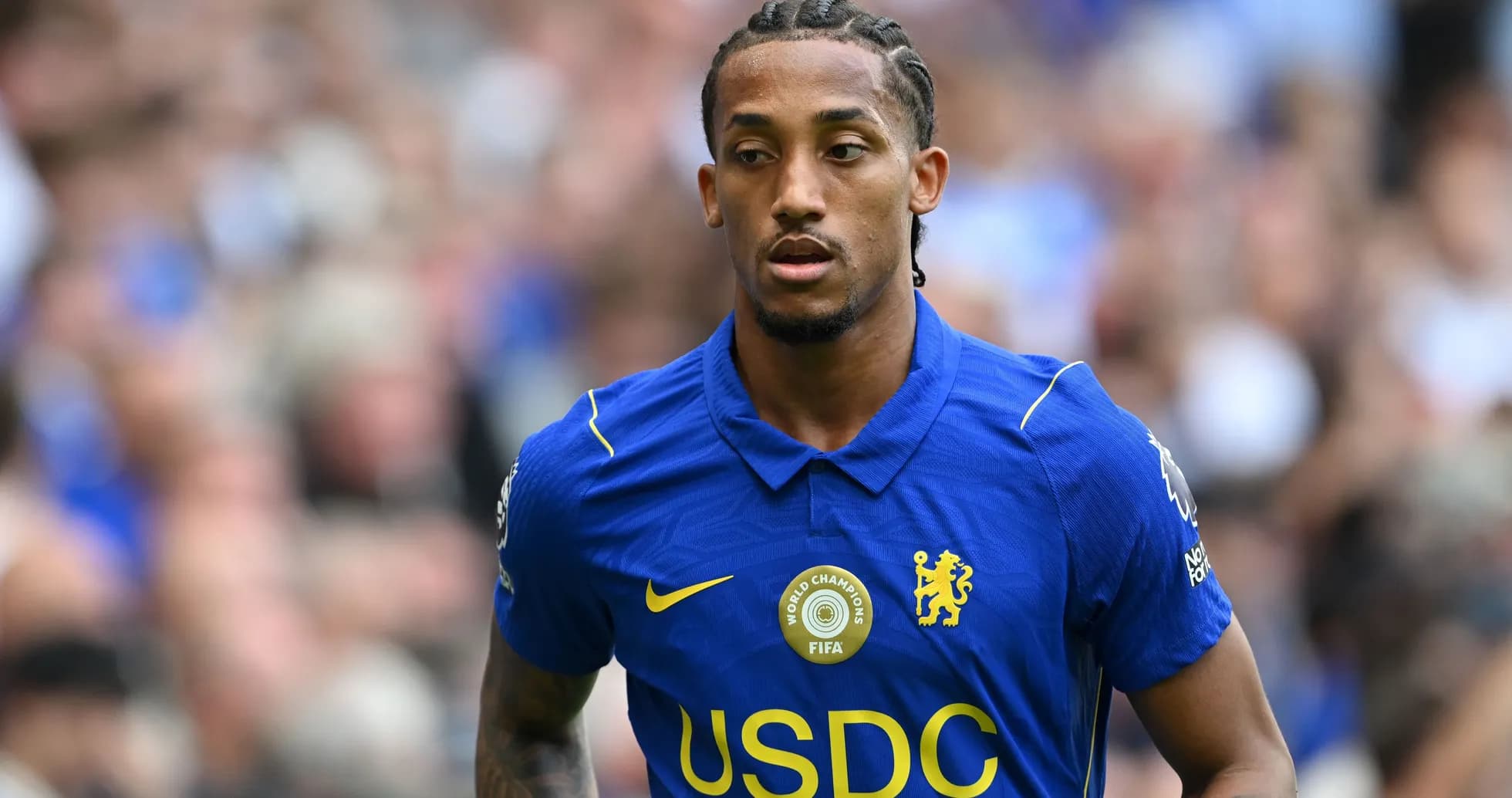 Player wearing Chelsea jersey on the field Player wearing Chelsea jersey on the field